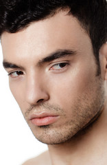 Obraz premium Charming and handsome man face over a white background