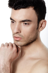 Obraz premium Charming and handsome man face over a white background