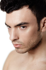 Obraz premium Charming and handsome man face over a white background