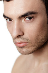 Obraz premium Charming and handsome man face over a white background