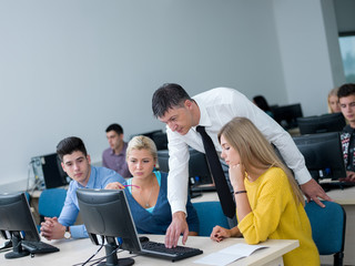 Fototapeta premium students with teacher in computer lab classrom