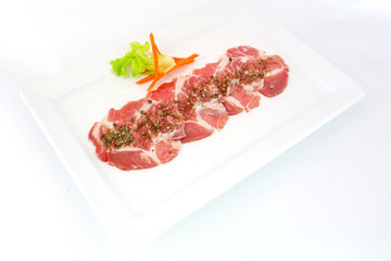 freshness slided pork on white dish for grill
