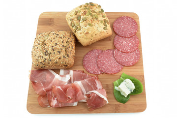 cereal bread, speck, salami and gorgonzola