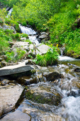 landscape with waterfall in the mountains