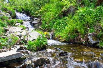 landscape with waterfall in the mountains