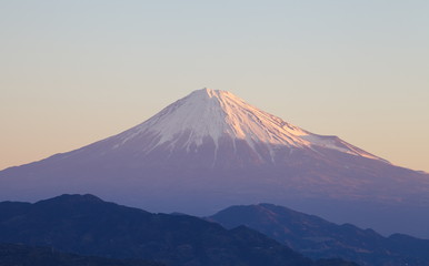 Naklejka na ściany i meble Top of Fuji mountain with morning sun light