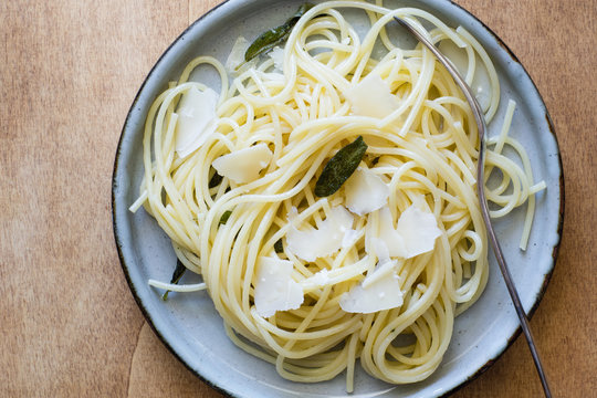 Spaghetti with Butter and Fried Sage Leaves Served with Parmesan Shavings