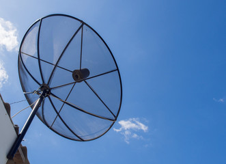 Satellite dish transmission data on blue sky background.Satellite dish communication technology network.