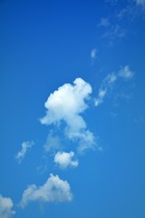 White clouds in the blue sky.