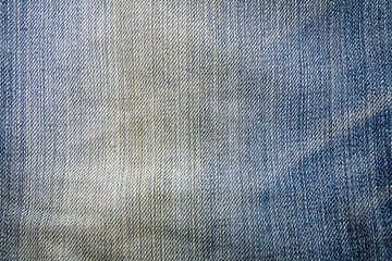 Texture of blue jeans textile close up