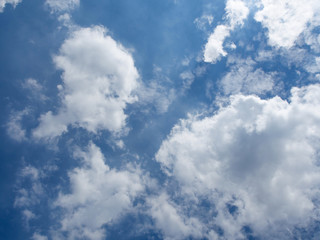 Blue sky background with white color group of cloud.On the bright sky at midday.