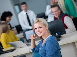 students with teacher  in computer lab classrom