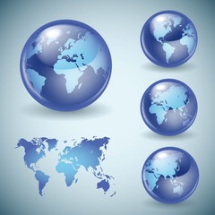 Set of shiny glass world globes
