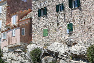 Fototapeta na wymiar Old traditional stone houses on a cliff in Split Croatia.