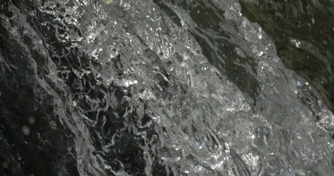 4K, abstract flowing and splashing water closeup