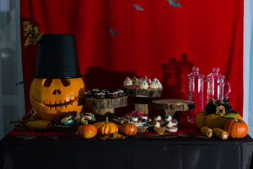 Pumpkins on the decorated table.