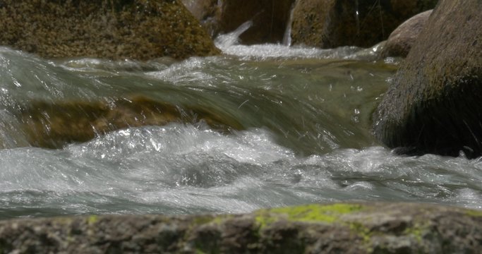 4K, abstract flowing and splashing water closeup