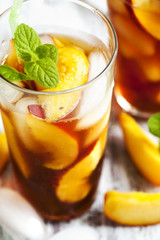 Glass of Peach Ice Tea close up