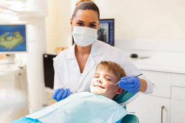little boy getting dental checkup - obrazy, fototapety, plakaty