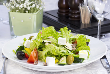 Greek salad on a table in a restaurant