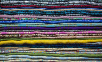 Background of the scrolls rolls colored colorful fabric