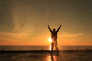 Silhouette Image of Happy Man Showing Winner Action