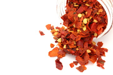 Red Chili Flakes on White Background
