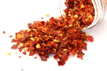 Red Chili Flakes on White Background