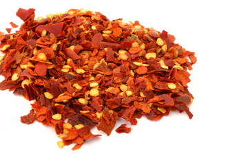 Red Chili Flakes on White Background