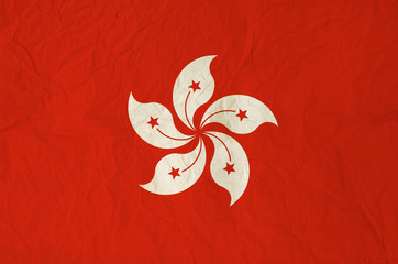 Naklejka premium Flag of Hong Kong with vintage old paper