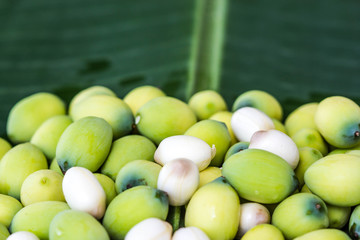 Lotus seed on banana leaf © nawin