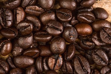 Coffee bean on grunge wooden background