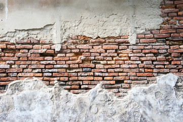 Old weathered brick wall fragment.
