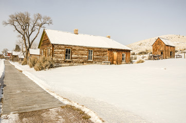 Two Faces in the windows of the old brick hotel look like old-fashioned portraits.  Could they be ghosts?