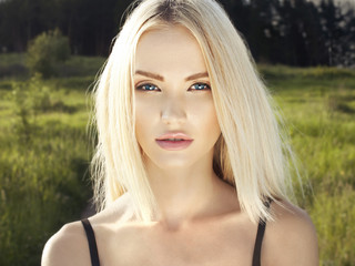 Beautiful Blond Woman in Forest