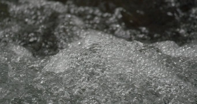 4K, abstract flowing and splashing water closeup