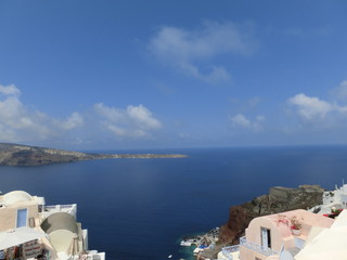 Fototapeta na wymiar View to the sea from Oia village of Santorini island in Greece