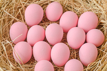 pink egg in basket