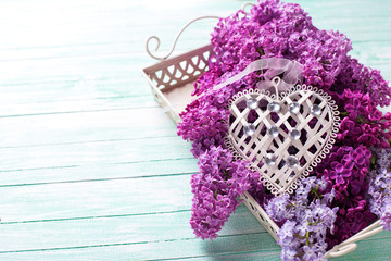 Postcard with  lilac flowers on tray and decorative heart