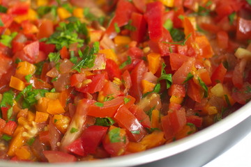 Fried vegetables in butter in a frying pan