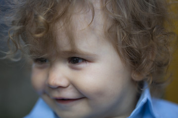 Close up portrait of a smiling little baby boy