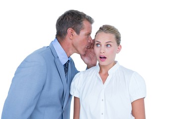  Businessman telling secret to a businesswoman