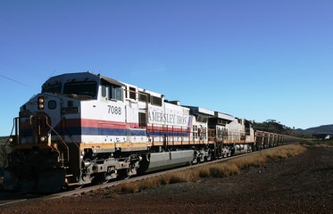 Tom Price, Australia - 2008, July 4:  Hamersley Rio Tinto Iron ore train with two front engines on...