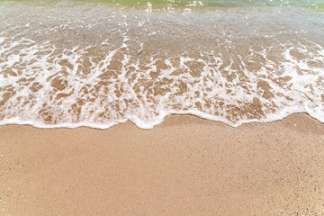 Fototapeta na wymiar Sand Beach And Sea Waves Background