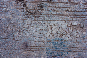 Textured walls with dirt.