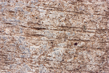 Textured walls with dirt.