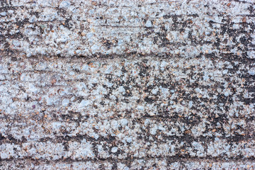 Textured walls with dirt.