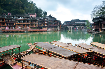 Fototapeta na wymiar Moored rowing boats on the Tuojiang river, Fenghuang ancient town, China