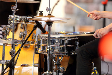Musician playing the drums at the concert