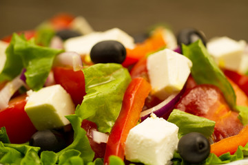 summer Greek salad with olives and feta cheese, closeup